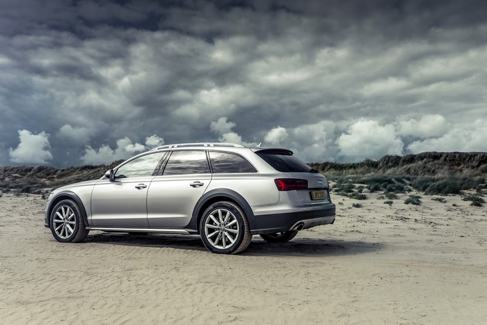 Silver Audi A6 Allroad Sport on a sandy beach