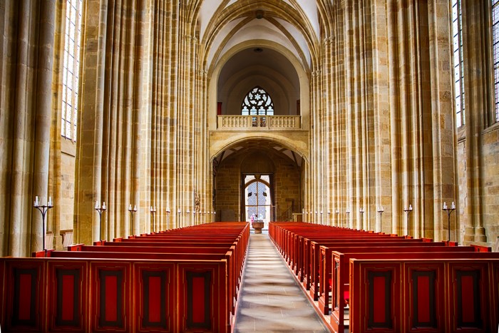 Interior of a large church with rows of pews