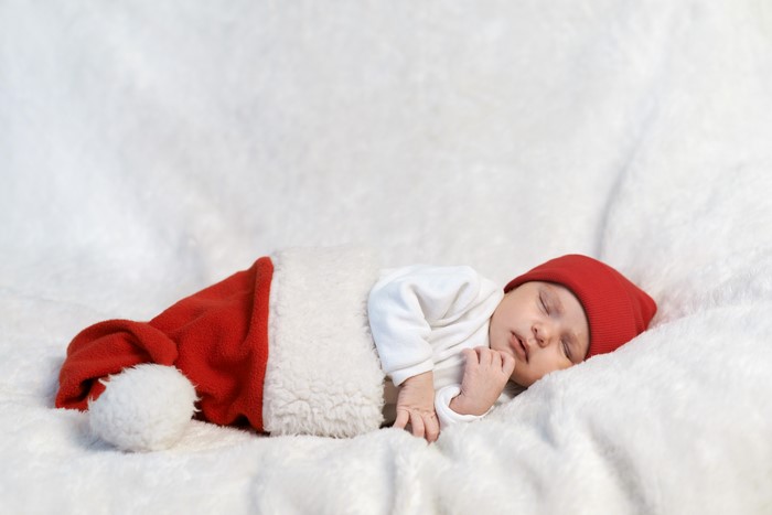 Baby sleeping in Santa hat