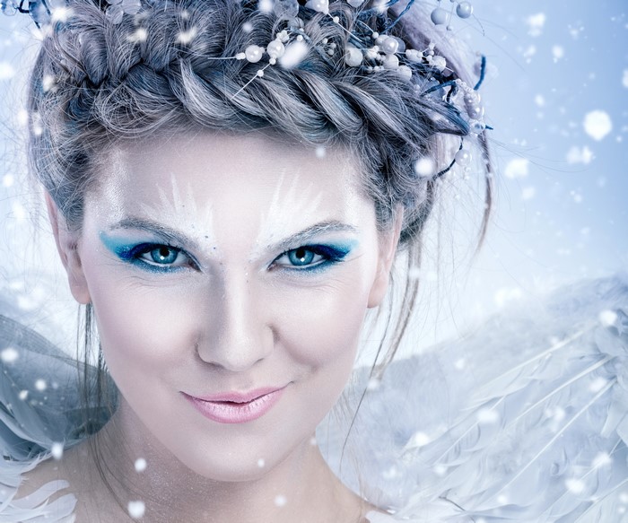 Woman with winter makeup and wings
