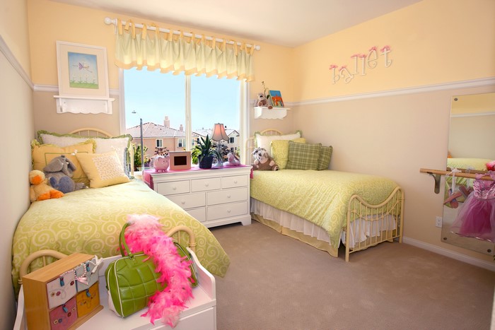 Children's bedroom with two beds and ballet decor