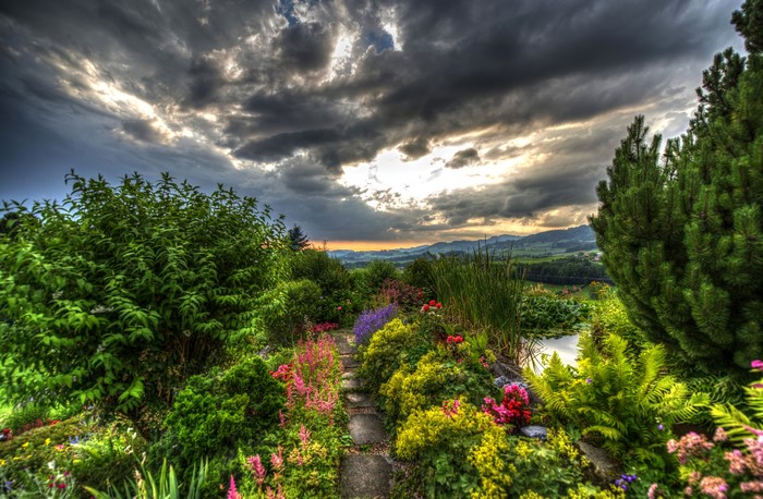 Garden path in Gommiswald, Switzerland with dramatic clouds