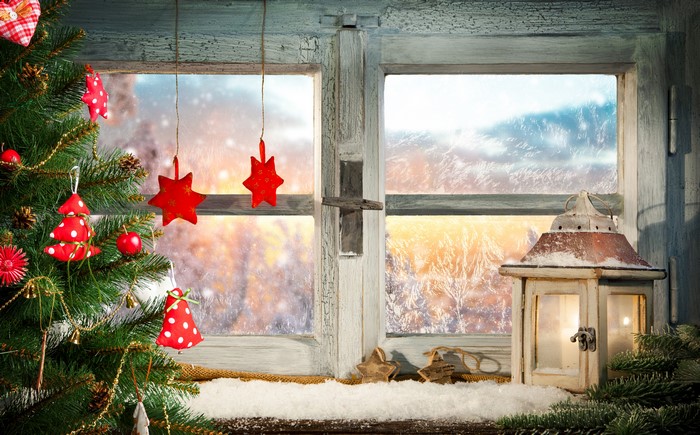 Christmas tree and window with snowy landscape