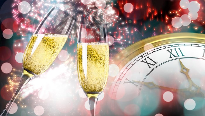 Champagne Glasses with Fireworks and Clock