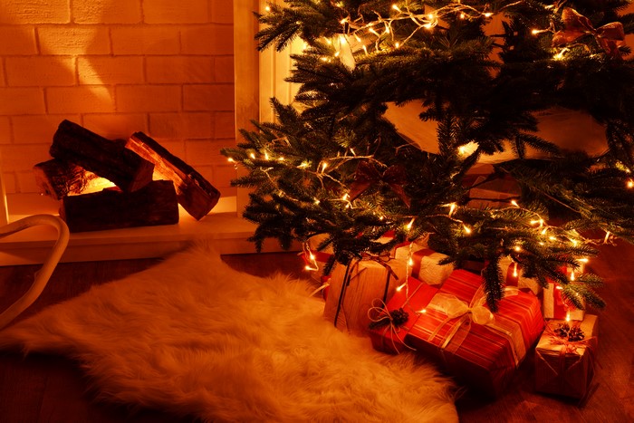 Christmas tree with gifts and fireplace