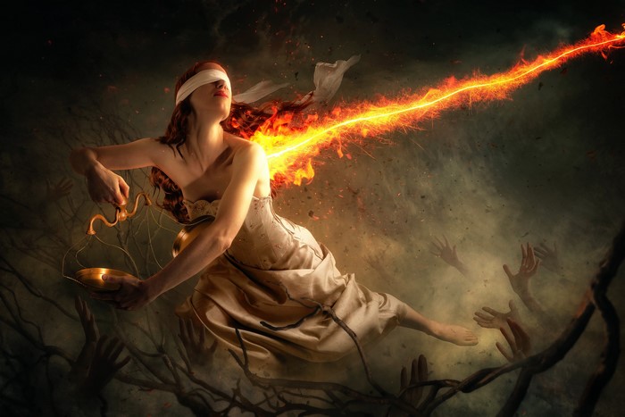 Themis with scales and fire