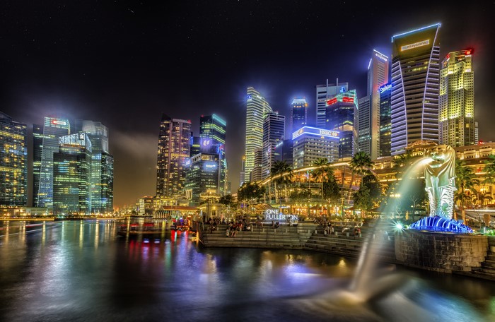 Singapore skyline at night with Merlion statue