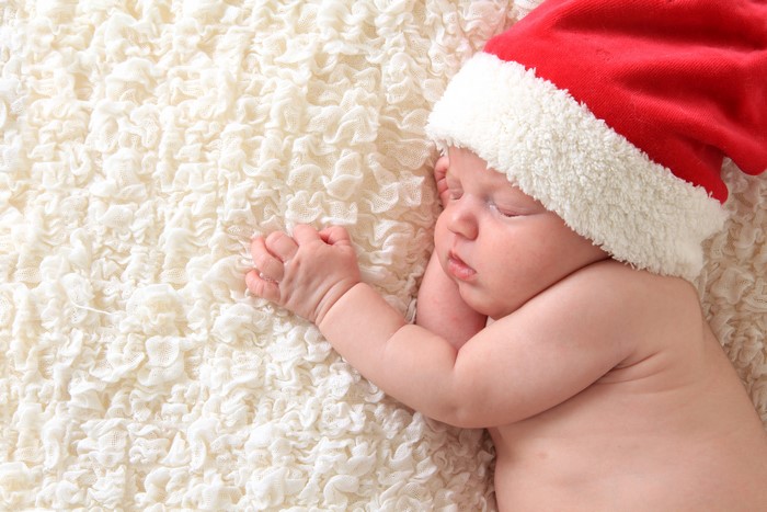 Baby sleeping in a Santa hat