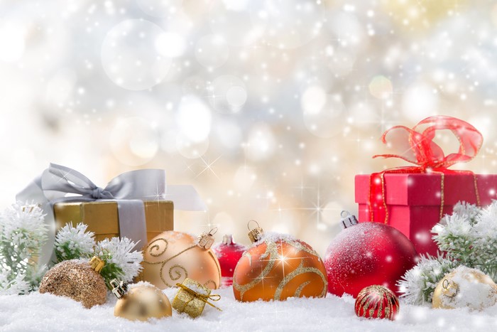 Christmas ornaments and gifts in snow