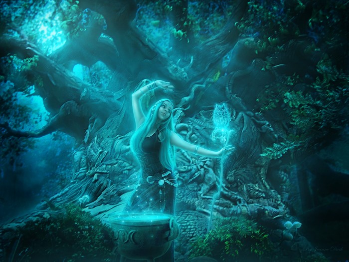 Woman casting a spell with an owl staff in a forest