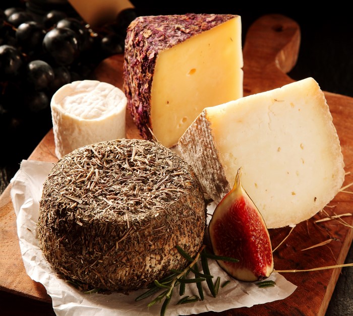 Assortment of cheeses with grapes and fig