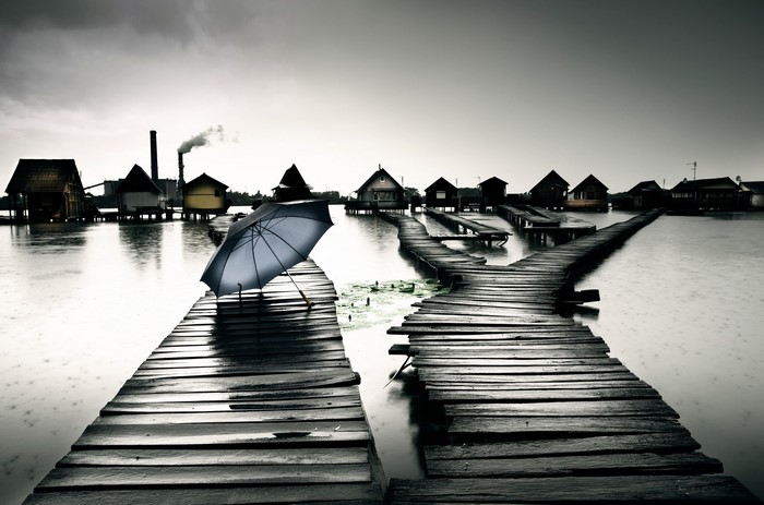 Bokod Lake Hungary with abandoned pier and umbrella