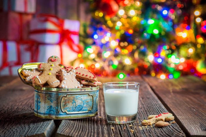 Christmas cookies and milk on wooden table