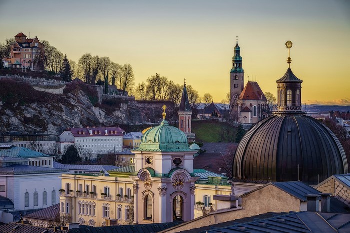 Salzburg cityscape with domes and towers at sunset