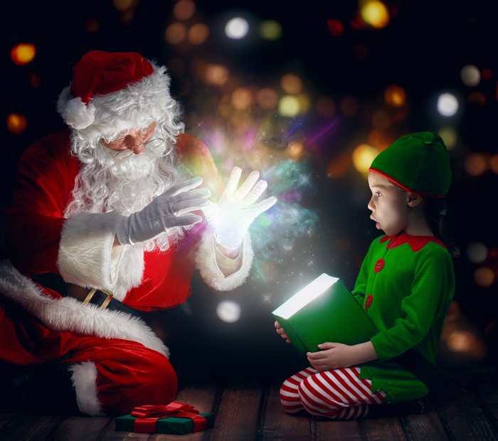 Santa Claus and Elf with Magical Book