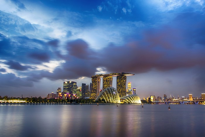 Singapore skyline with Marina Bay Sands and Gardens by the Bay at dusk