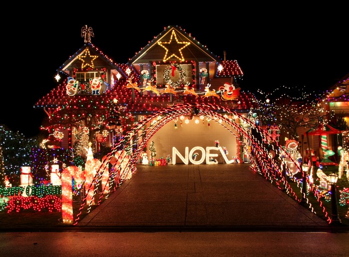 House decorated with Christmas lights at night