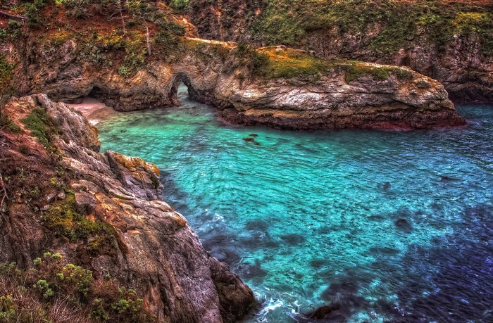 Rocky cove with turquoise water in California