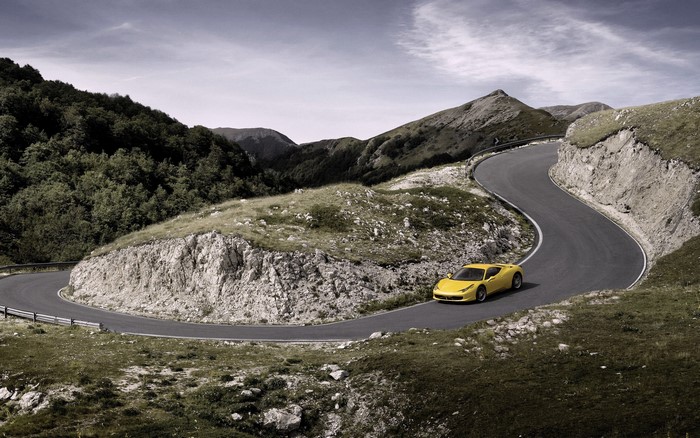 Yellow Ferrari 458 Italia on a Mountain Road