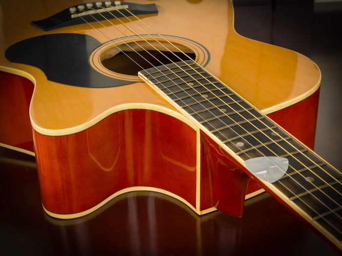 Acoustic guitar with a pick