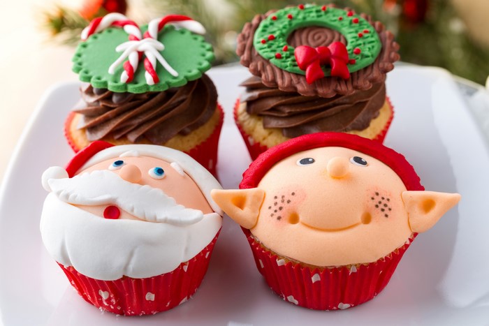 Christmas cupcakes with Santa Claus and elf designs