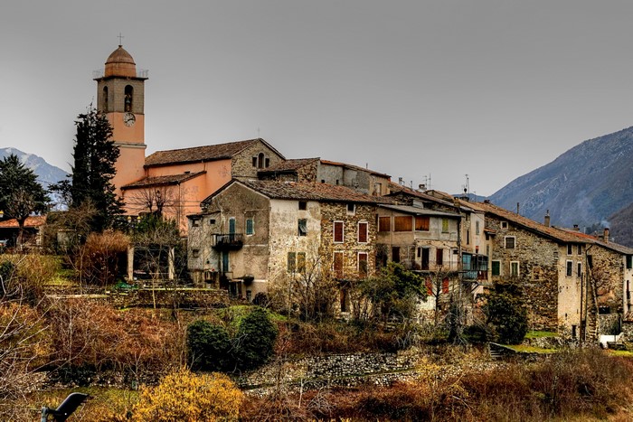 Village with church in Massoins, France