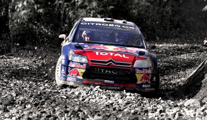 Citroen C4 WRC rally car on a gravel road