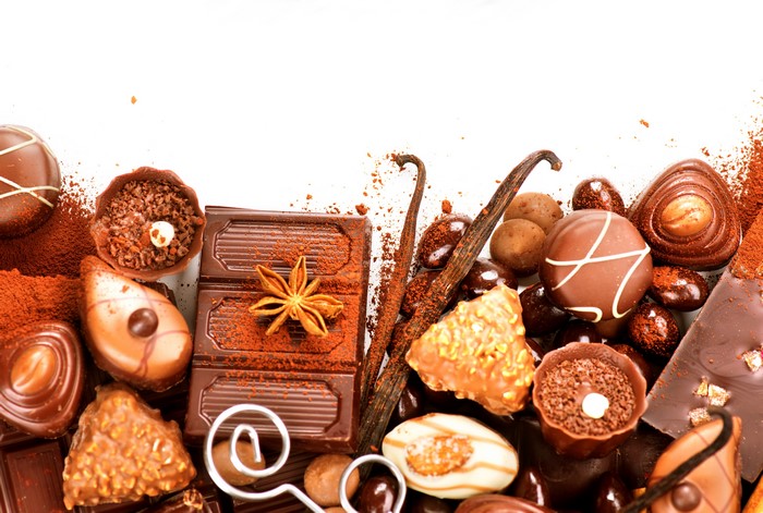 Assortment of chocolates and cocoa powder