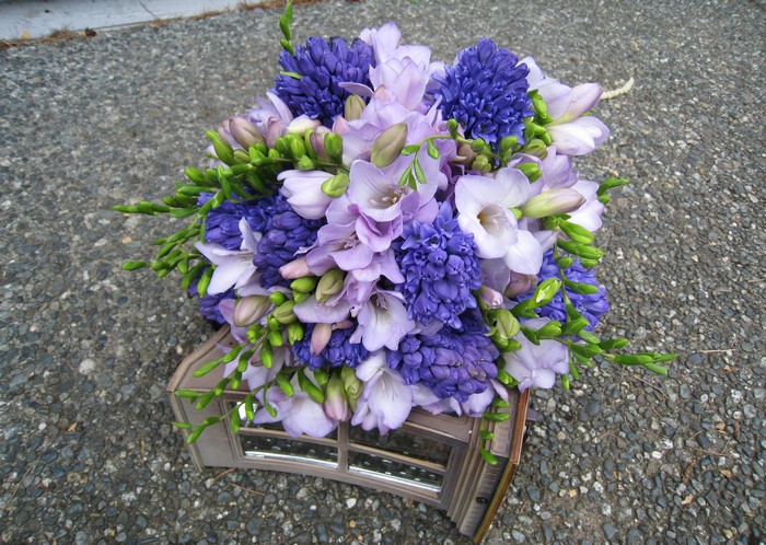 Purple and white flower bouquet with hyacinths and freesia