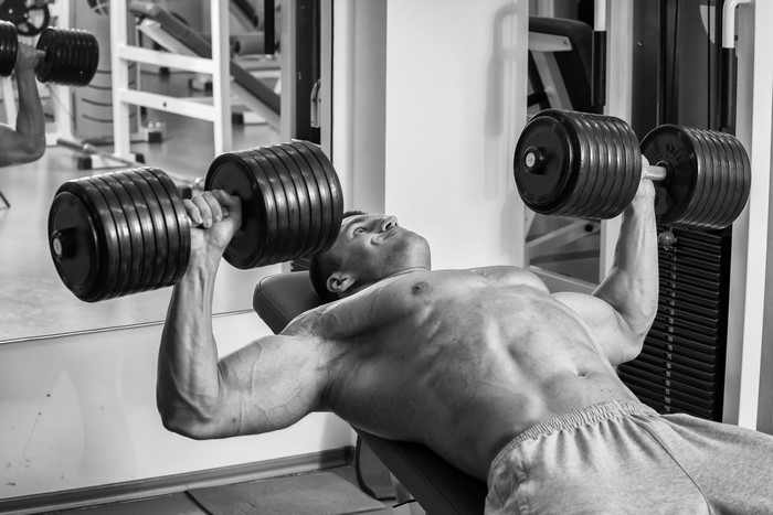 Man lifting dumbbells during workout