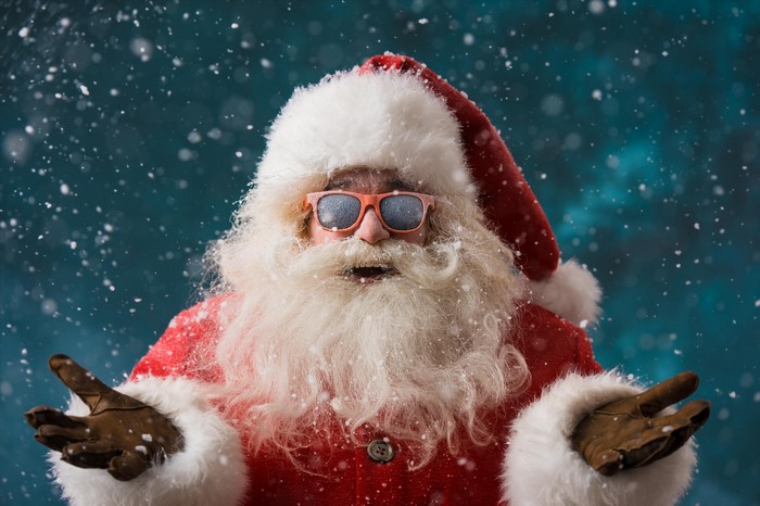Santa Claus wearing sunglasses in the snow