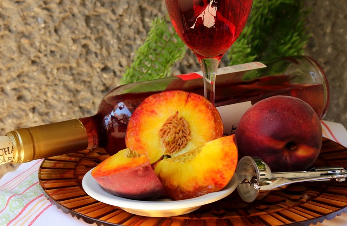 Still-life of wine and peaches
