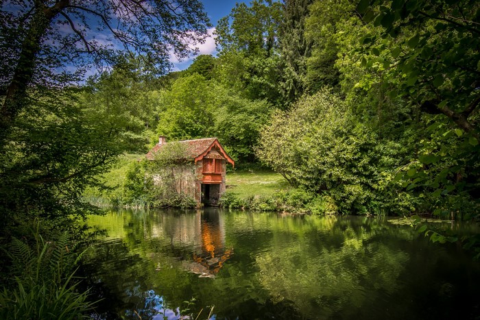 Boathouse on a river in the Cotswolds, England