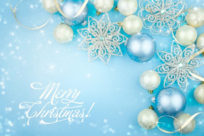 Christmas ornaments and snowflakes on blue background