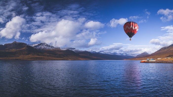 Hot air balloon over Reydarfjordur Bay, Iceland