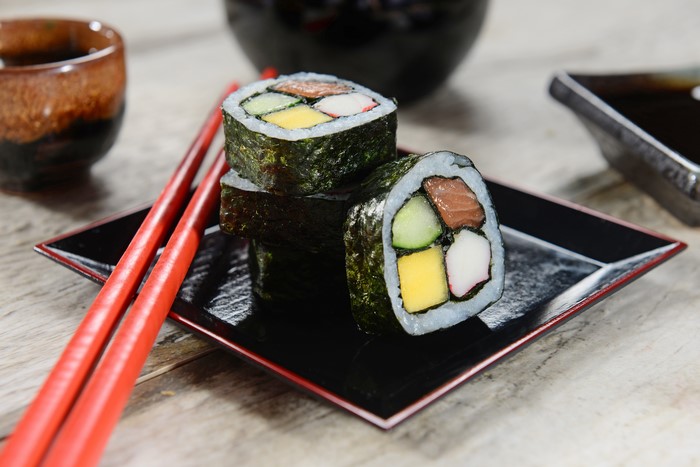 Sushi rolls with chopsticks and soy sauce