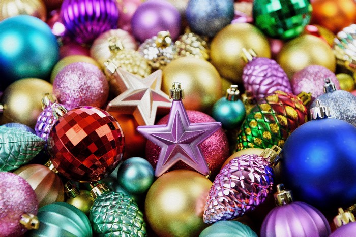 Many Christmas ornaments in various colors and shapes