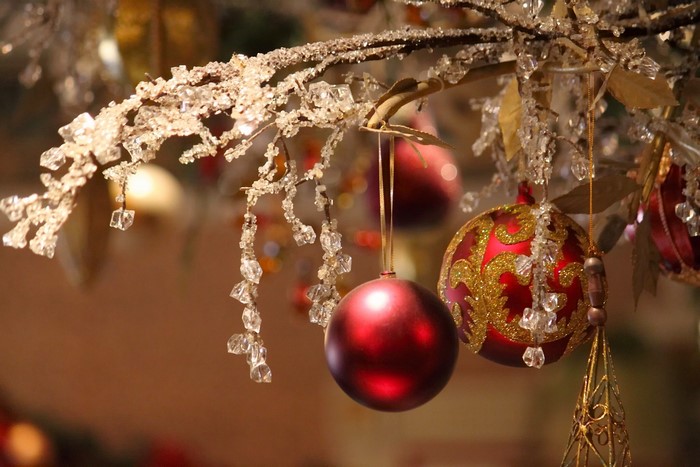 Christmas ornaments on a decorated branch