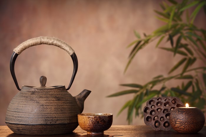 Tea set with candle and bamboo