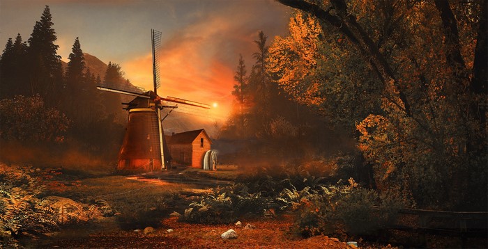 Windmill at sunset with trees and a small house