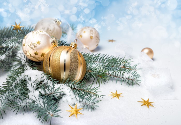 Christmas ornaments and pine branches in snow