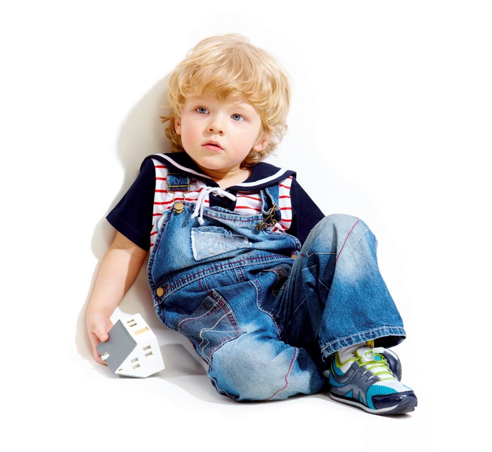 Boy in Denim Overalls Holding Toy House
