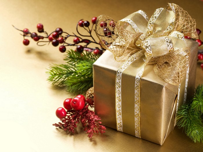 Golden Christmas Gift with Berries and Pine