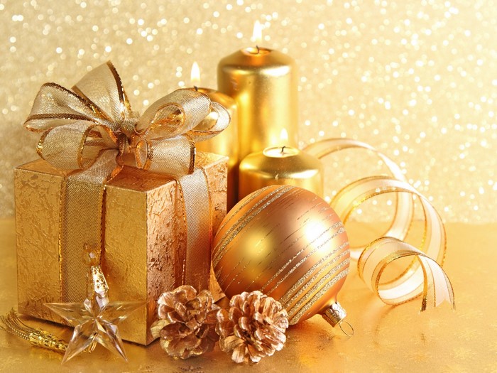 Gold Christmas decorations with gift, candles, and ornaments