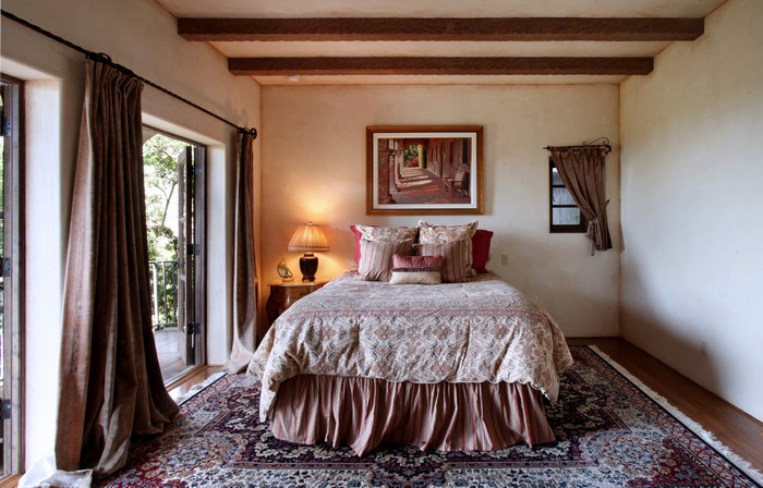 Bedroom with Bed, Carpet, Lamp, and Curtains