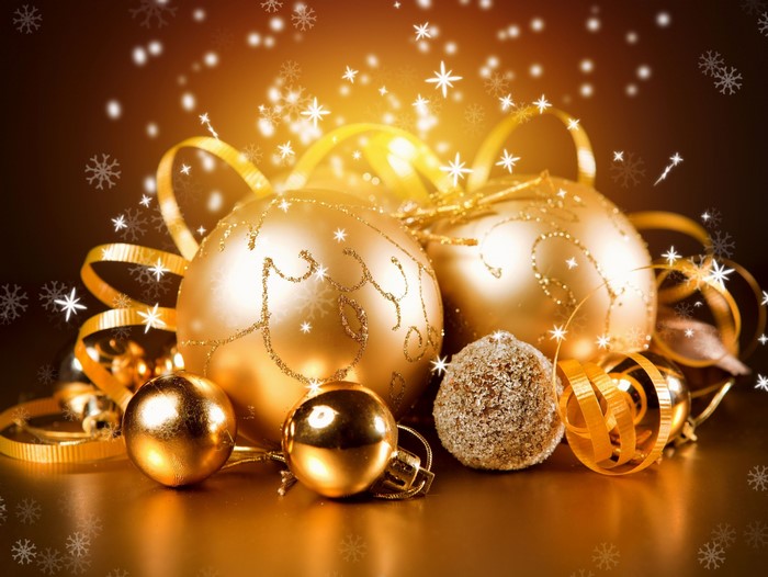 Golden Christmas ornaments with ribbons and snowflakes