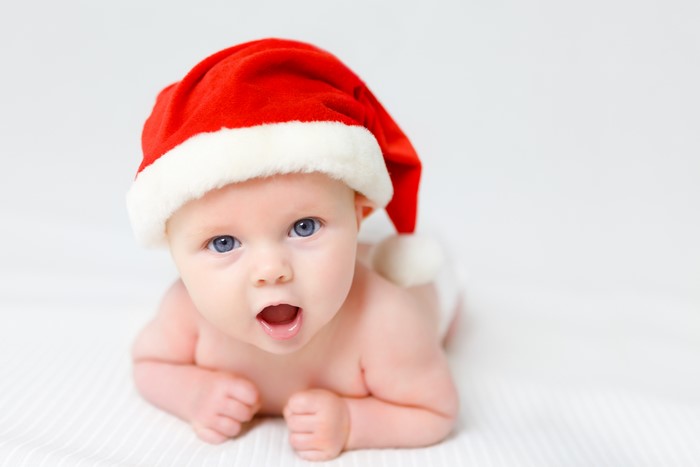 Baby wearing a Santa hat