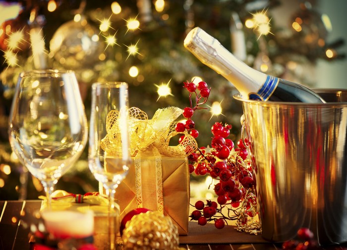 Champagne and Gifts by Christmas Tree