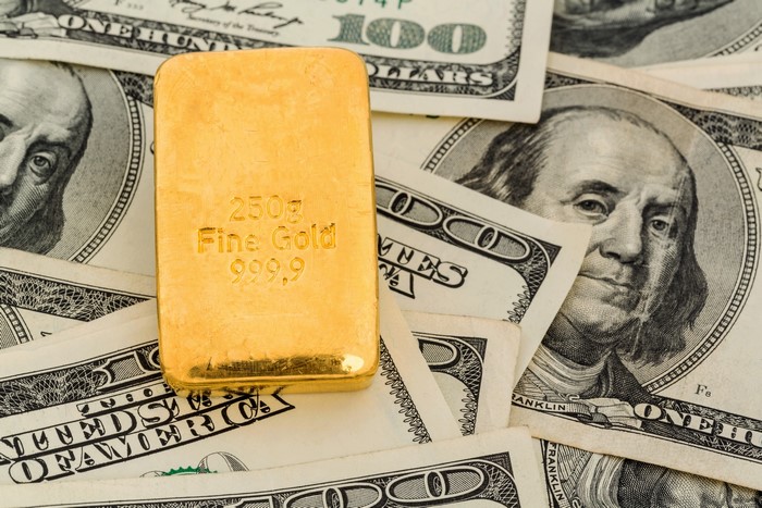 Gold Bar and 100 Dollar Banknotes 4K