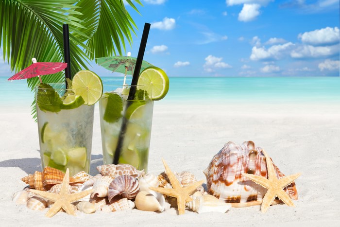 Two Mojitos on a Sandy Beach with Seashells